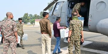 Polling personnel left by helicopter